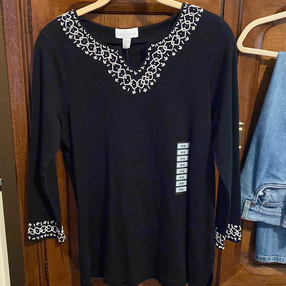 Black top v-neck with white beads and cuffs white beads. Petite/sm
